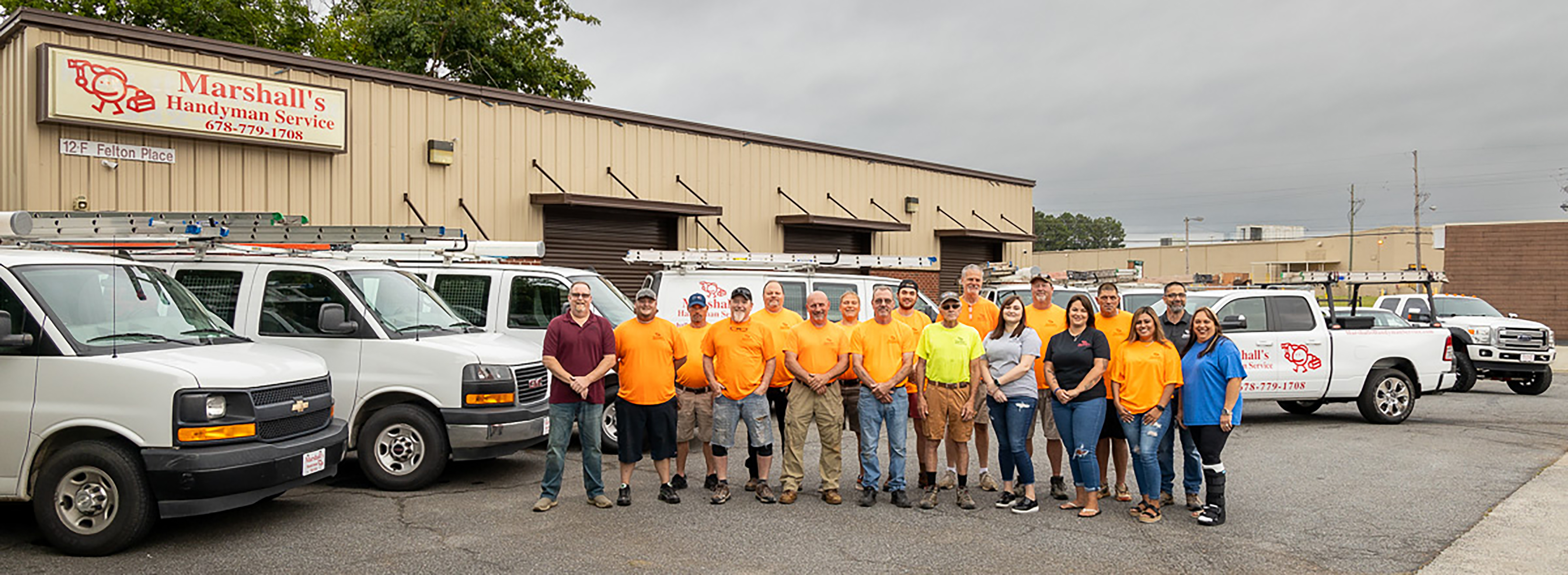 Marshall's Handyman Service team in front of their trucks