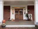 Exterior remodel, porch with wooden french doors and posts.